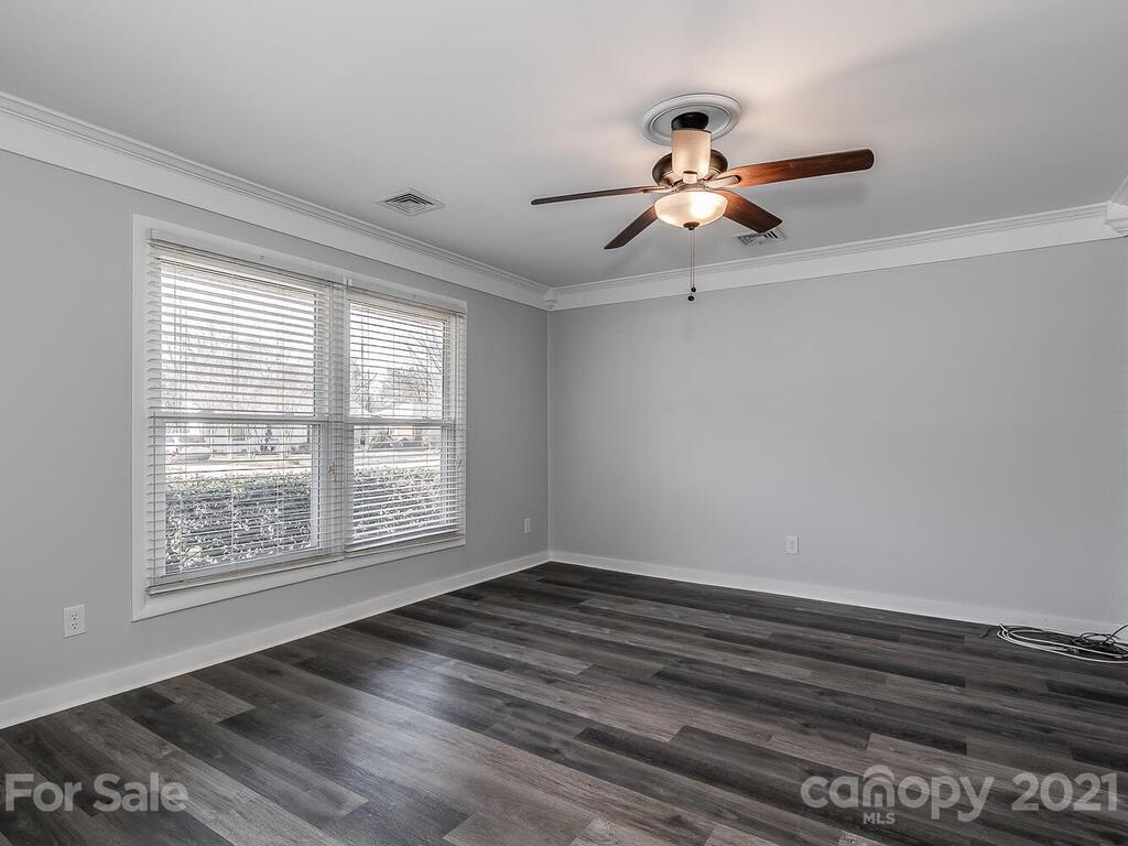 5223 Seacroft Road Charlotte, NC 28210 - Photo 5 of 23 a view of room with window ceiling fan and hardwood floor