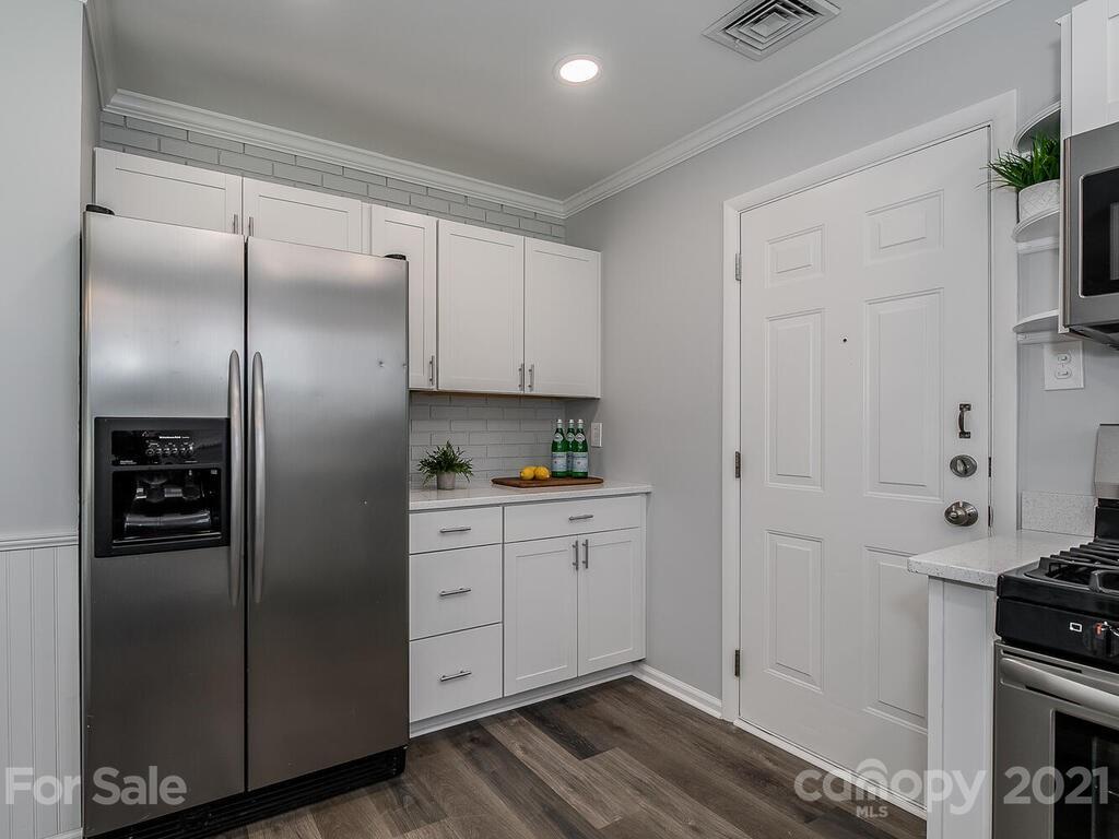 5223 Seacroft Road Charlotte, NC 28210 - Photo 8 of 23 a kitchen with stainless steel appliances granite countertop a refrigerator and a stove