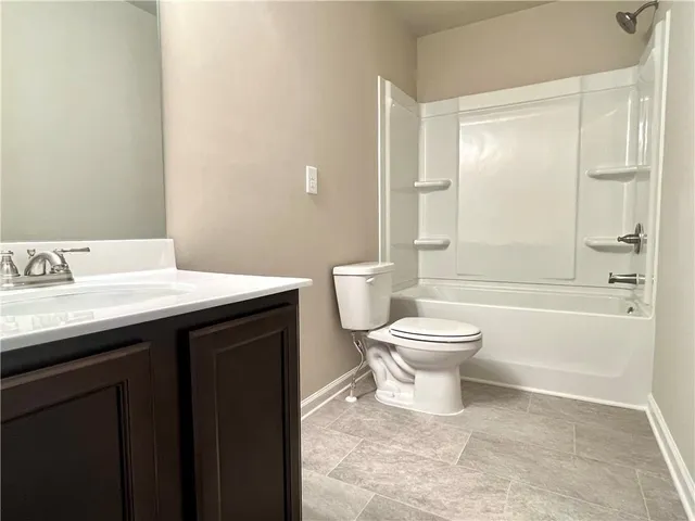 a bathroom with a toilet a sink and a bathtub