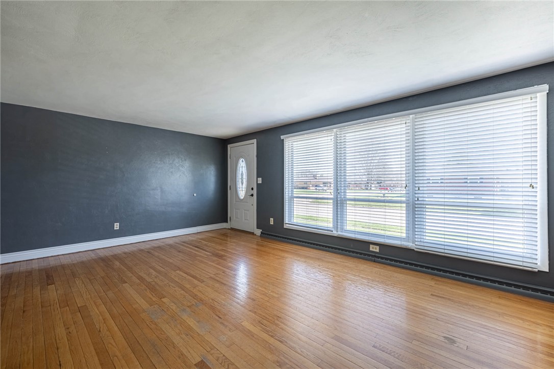5235 West Ridgewood Road Springfield, OH 45503 - Photo 4 of 32 This inviting space features lustrous hardwood flooring and abundant natural light.