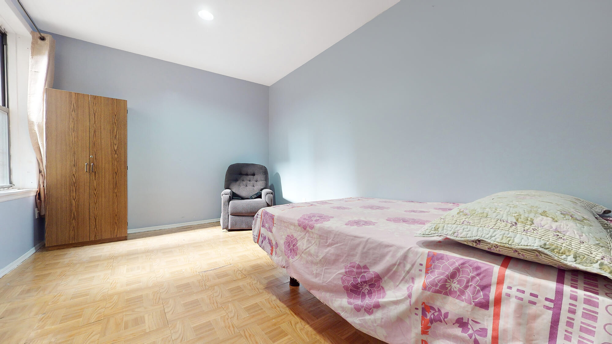 Undisclosed Address Manhattan, NY 10031 - Photo 11 of 13 a bedroom with a bed and a window