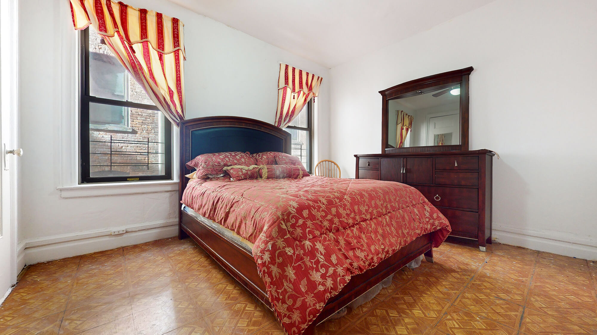 Undisclosed Address Manhattan, NY 10031 - Photo 2 of 13 a bedroom with a bed and a large window