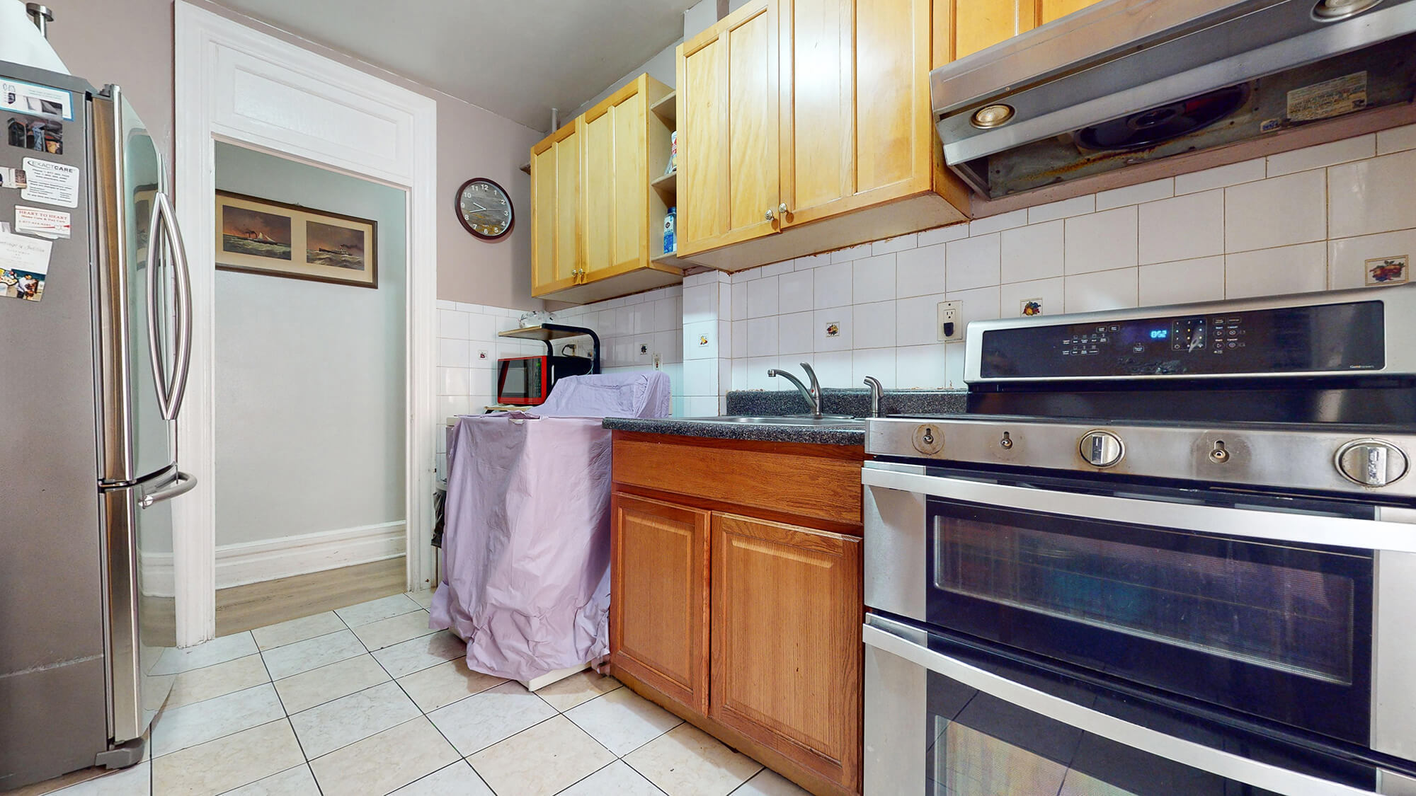 Undisclosed Address Manhattan, NY 10031 - Photo 5 of 13 a kitchen with stainless steel appliances granite countertop a refrigerator and a stove