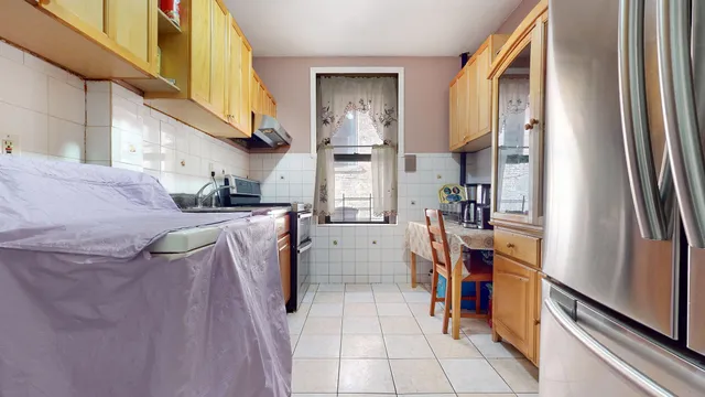 a kitchen with a refrigerator and washer