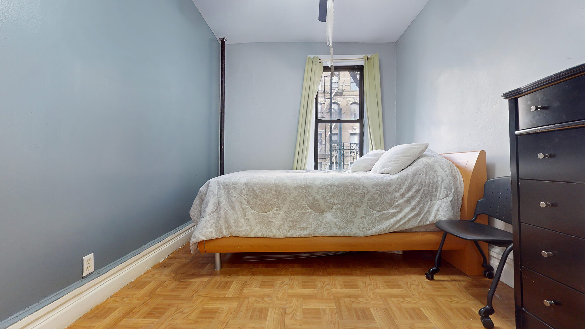 Undisclosed Address Manhattan, NY 10031 - Photo 8 of 13 a bedroom with a bed and a window