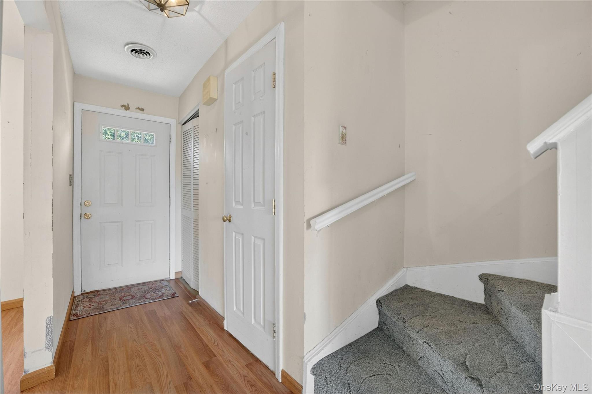 116 Fields Lane Peekskill, NY 10566 - Photo 14 of 40 a view of a hallway with wooden floor and entryway