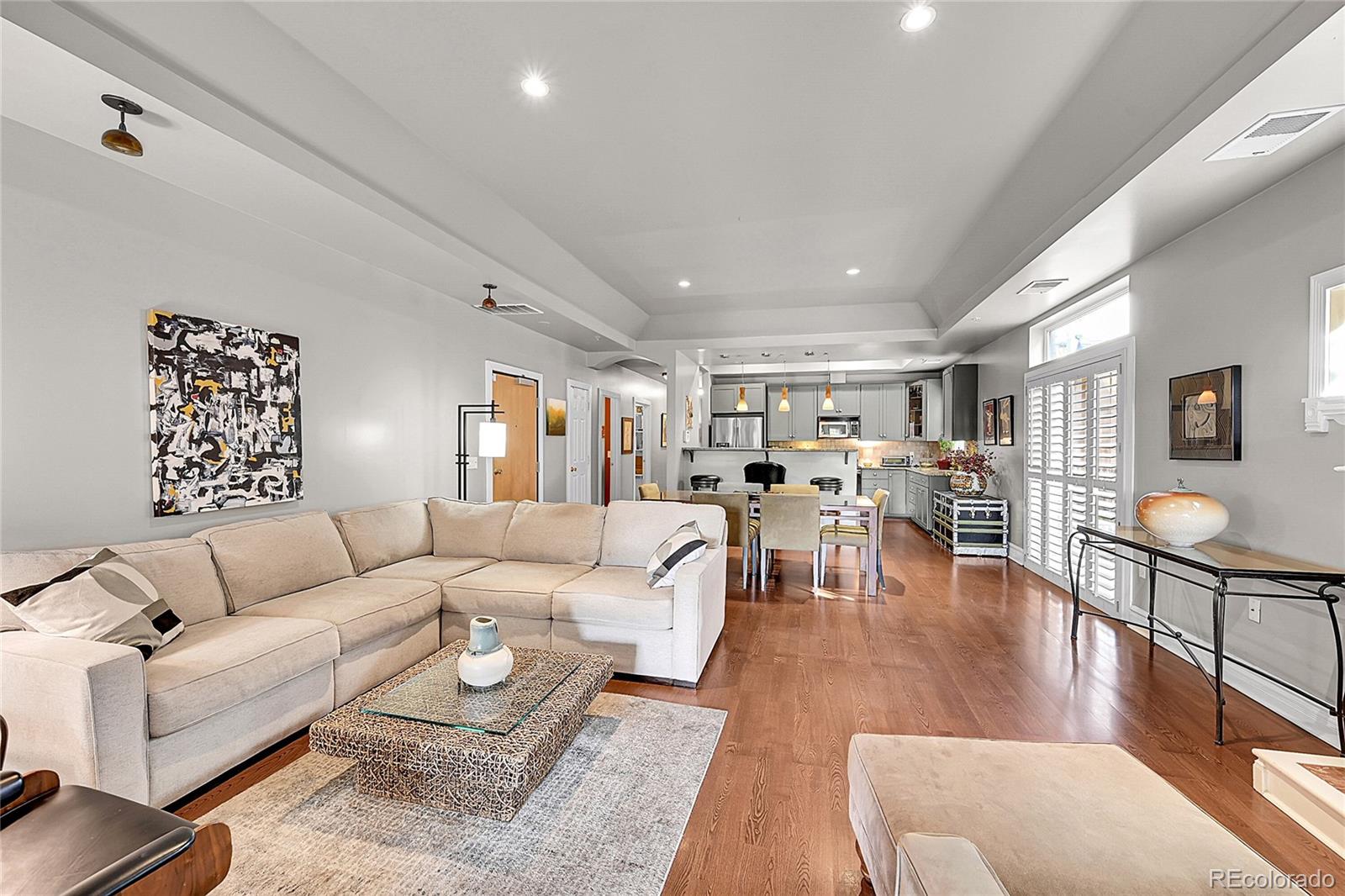 1352 Pennsylvania Street, Unit 2 Denver, CO 80203 - Photo 11 of 45 a living room with furniture and wooden floor