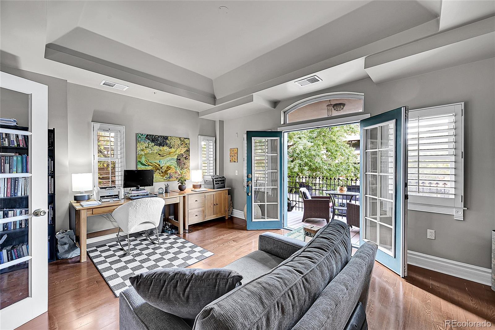 1352 Pennsylvania Street, Unit 2 Denver, CO 80203 - Photo 13 of 45 a living room with furniture and a large window