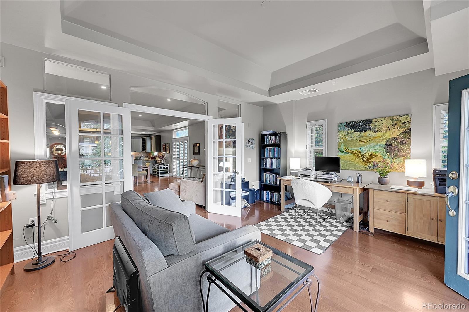 1352 Pennsylvania Street, Unit 2 Denver, CO 80203 - Photo 14 of 45 a living room with furniture and a wooden floor