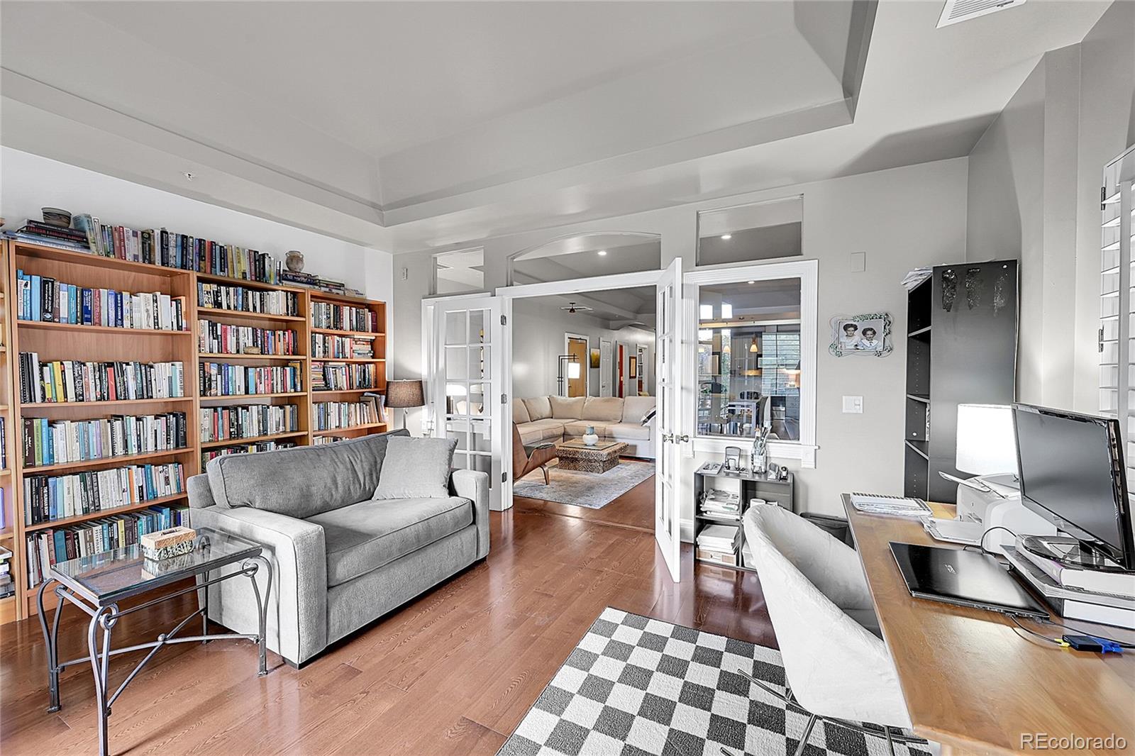 1352 Pennsylvania Street, Unit 2 Denver, CO 80203 - Photo 15 of 45 a living room with furniture and a flat screen tv
