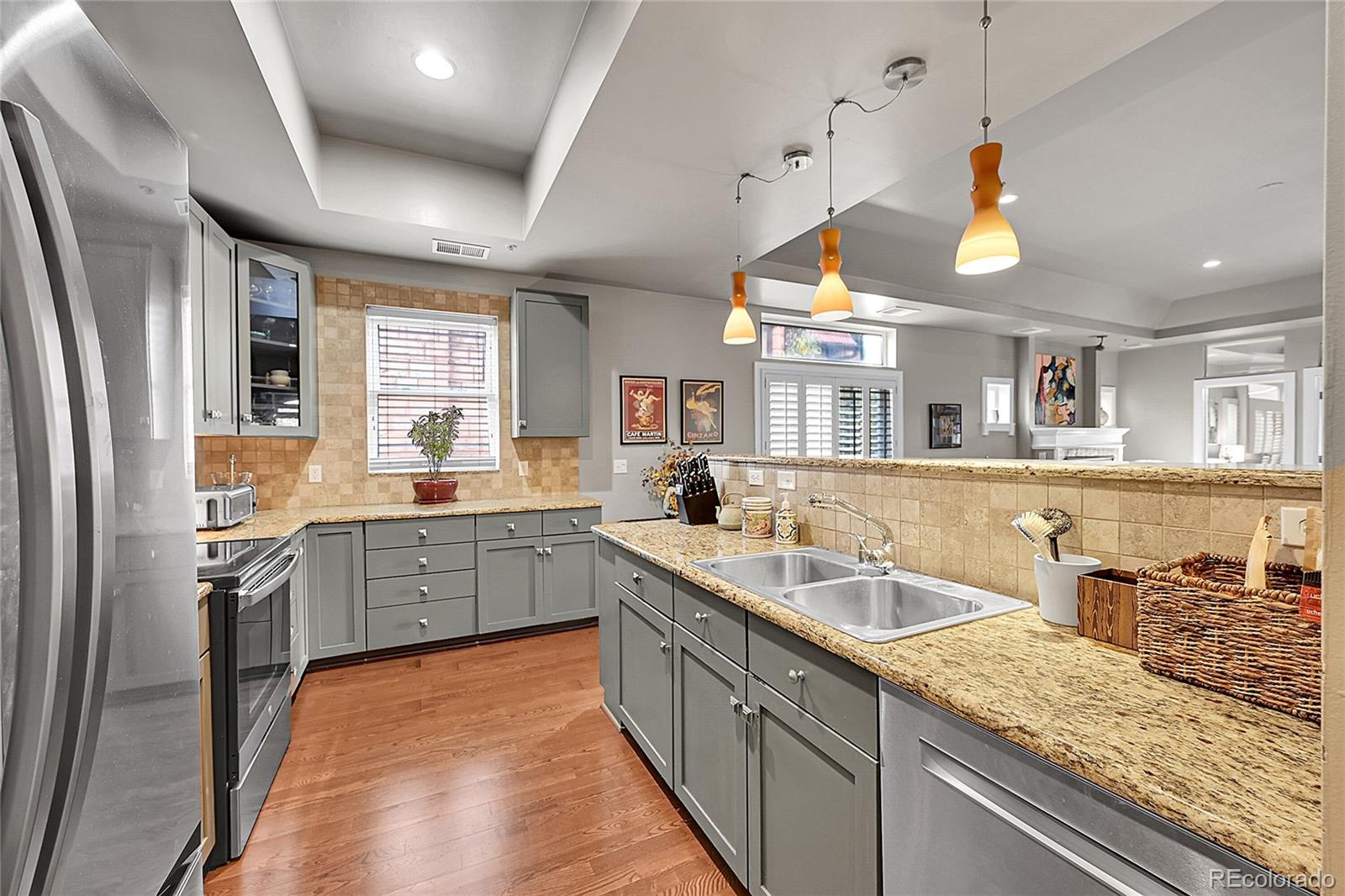 1352 Pennsylvania Street, Unit 2 Denver, CO 80203 - Photo 18 of 45 a kitchen with a sink stove and refrigerator