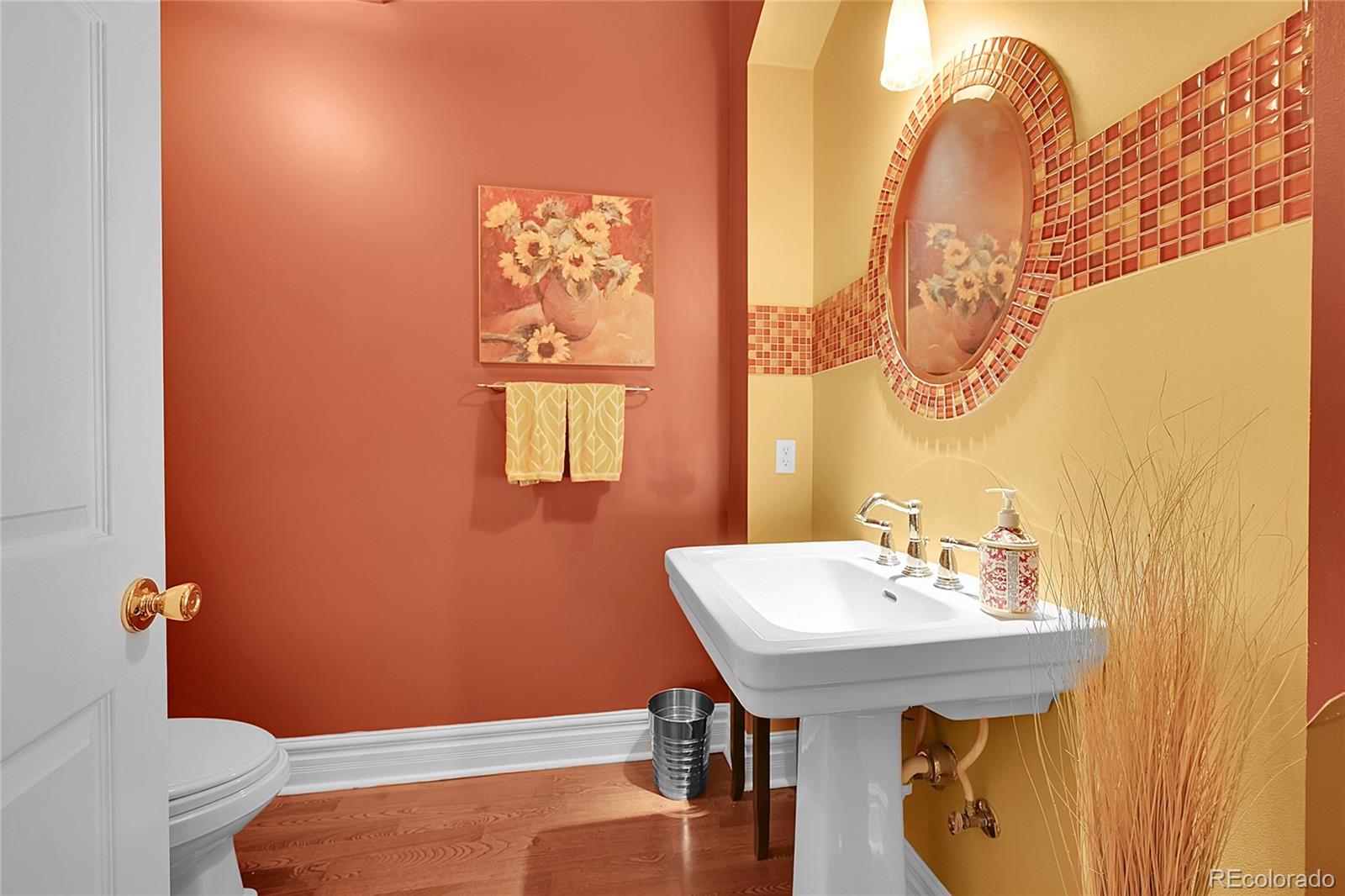 1352 Pennsylvania Street, Unit 2 Denver, CO 80203 - Photo 22 of 45 a bathroom with a sink a toilet and mirror