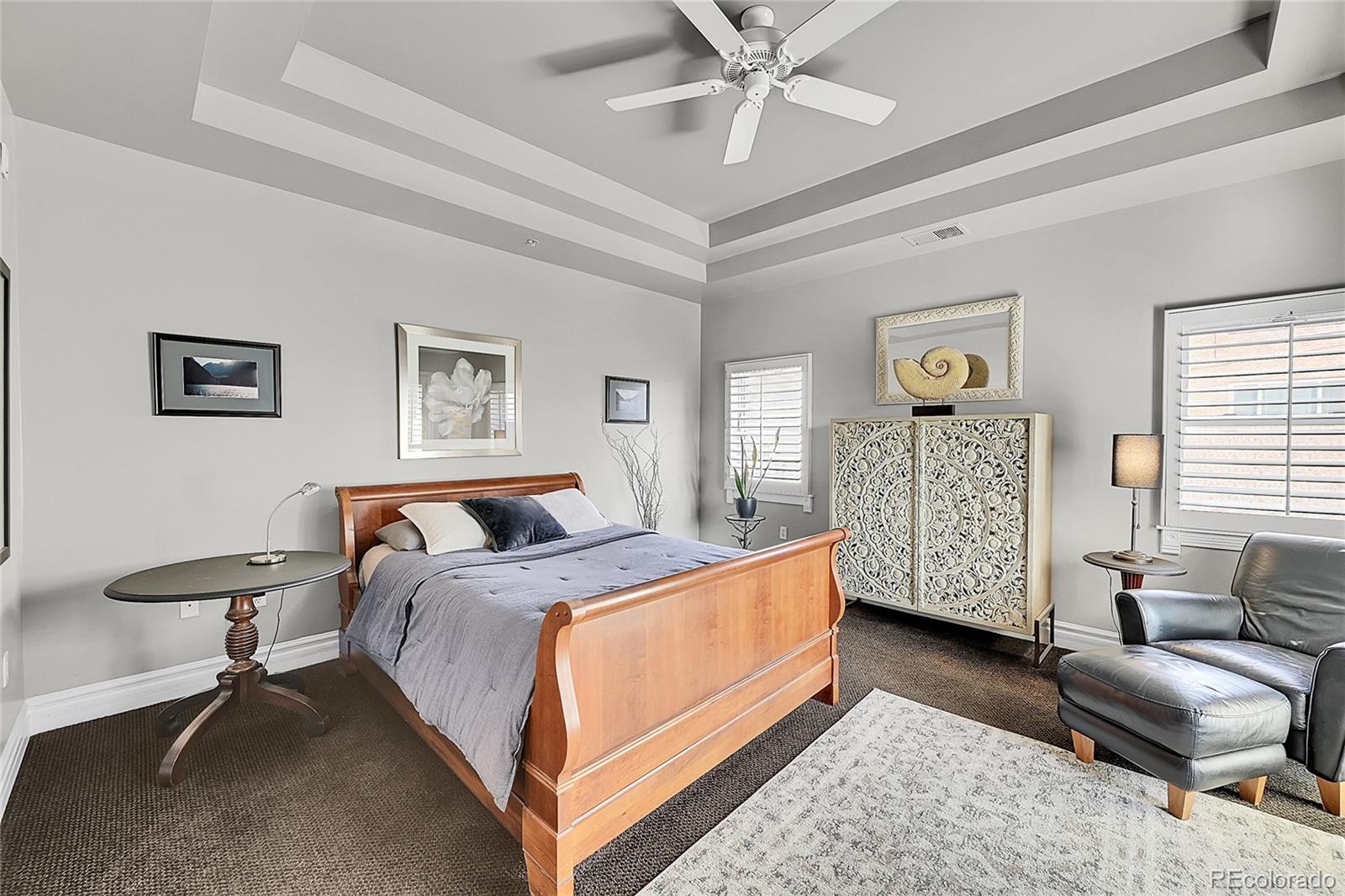 1352 Pennsylvania Street, Unit 2 Denver, CO 80203 - Photo 29 of 45 a bedroom with a bed a couch and dresser