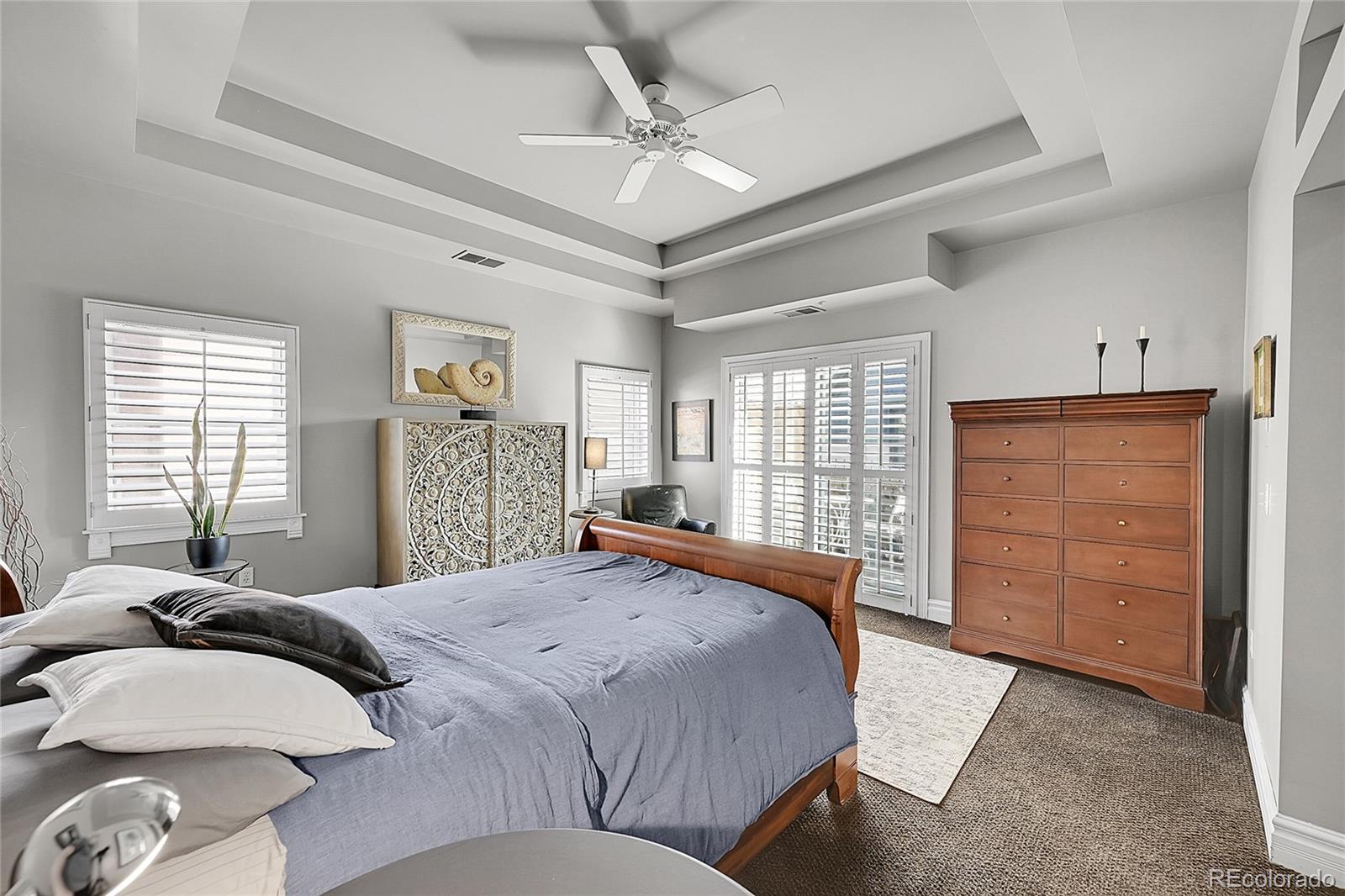 1352 Pennsylvania Street, Unit 2 Denver, CO 80203 - Photo 30 of 45 a bedroom with a large bed closet and window