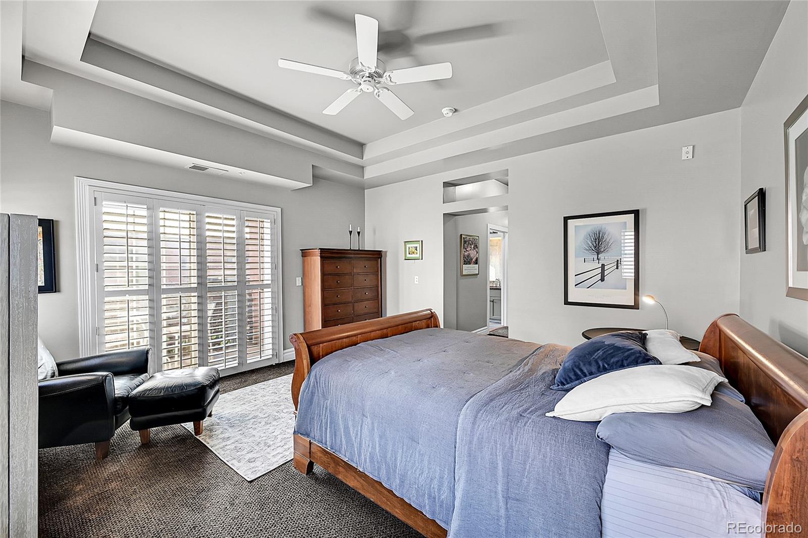 1352 Pennsylvania Street, Unit 2 Denver, CO 80203 - Photo 32 of 45 a bedroom with a bed and a couch