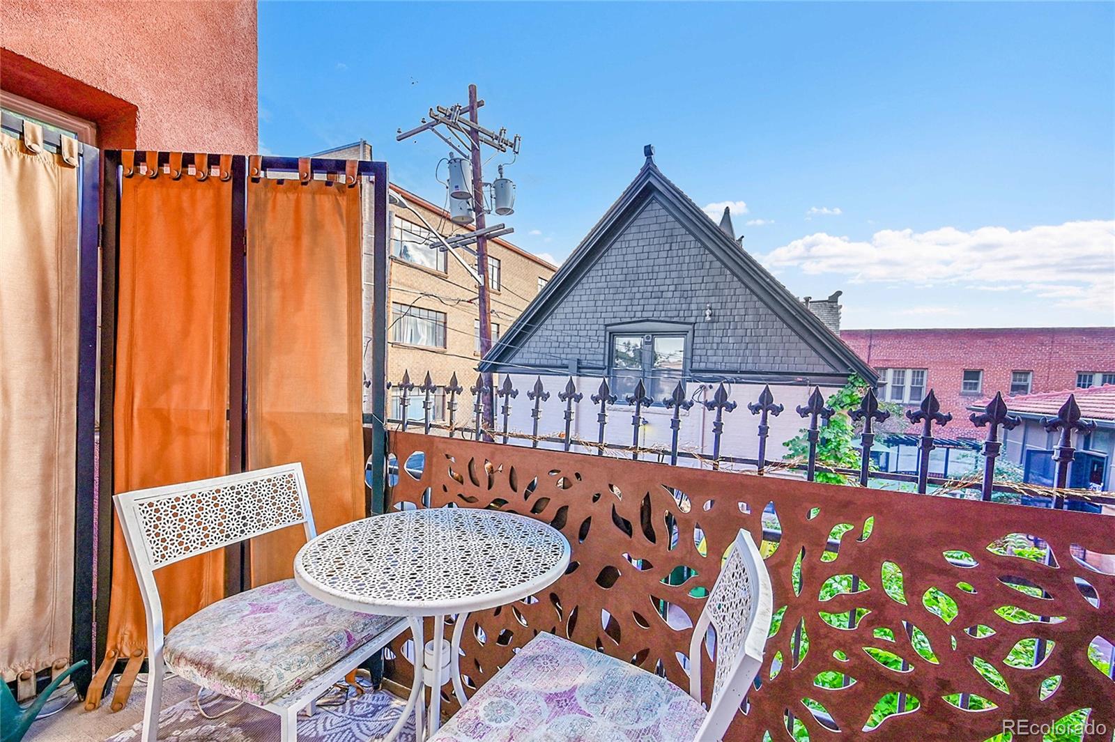1352 Pennsylvania Street, Unit 2 Denver, CO 80203 - Photo 33 of 45 a view of a chairs and table in the patio
