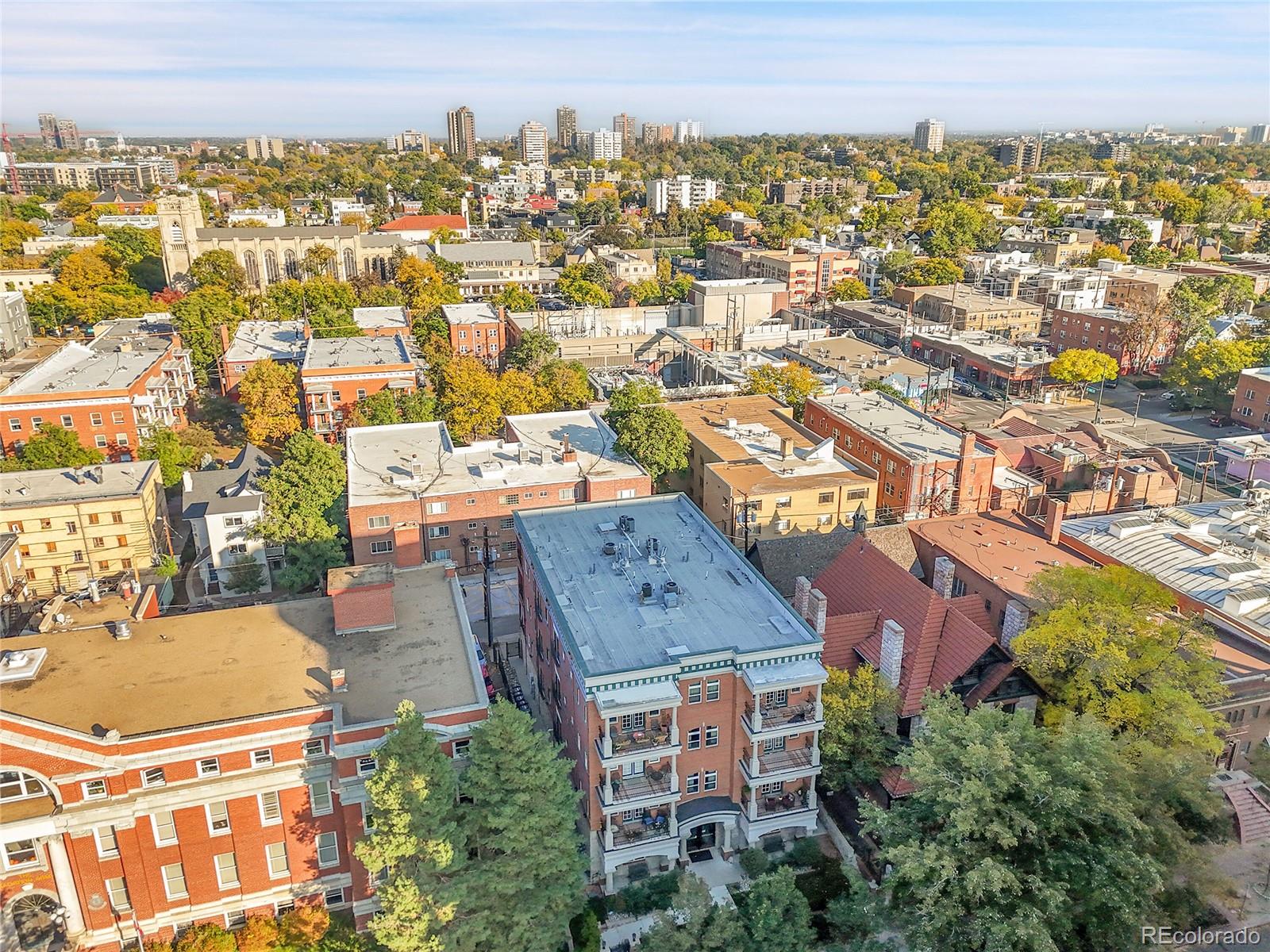 1352 Pennsylvania Street, Unit 2 Denver, CO 80203 - Photo 40 of 45 an aerial view of residential houses with outdoor space