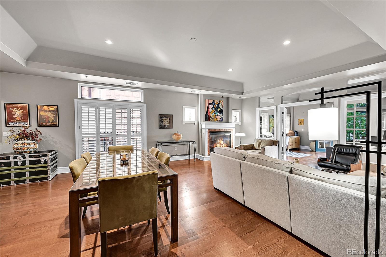 1352 Pennsylvania Street, Unit 2 Denver, CO 80203 - Photo 6 of 45 a living room with furniture a dining table and a large window