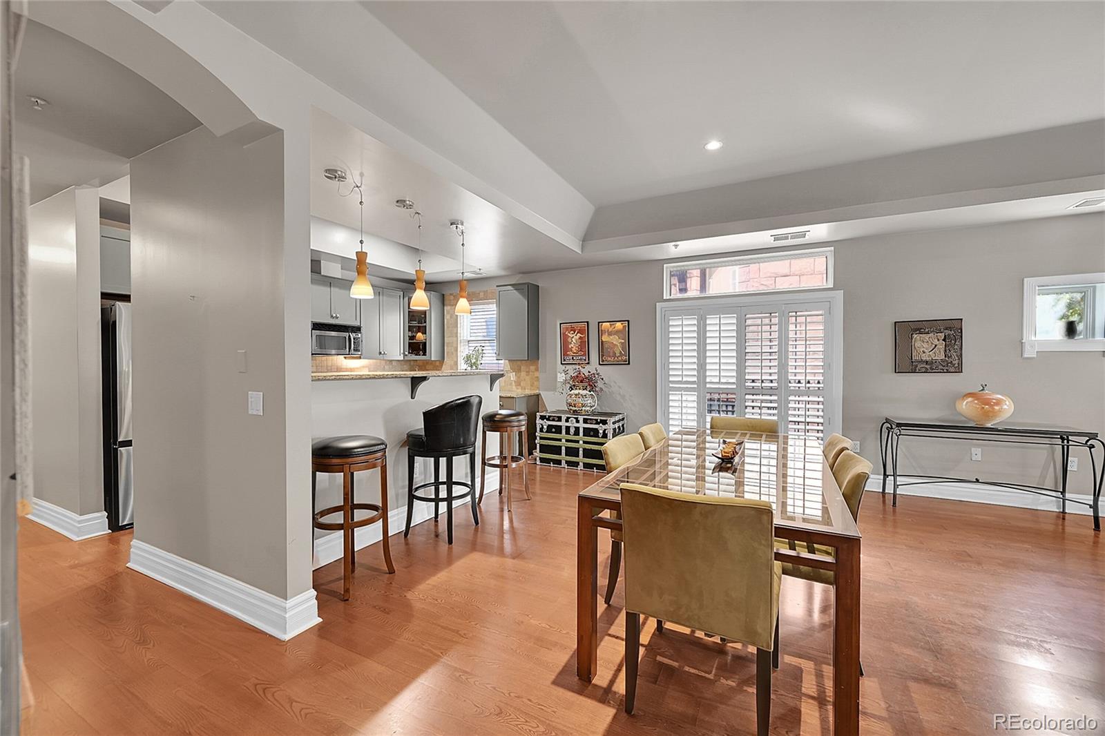 1352 Pennsylvania Street, Unit 2 Denver, CO 80203 - Photo 7 of 45 a view of a dining room with furniture and wooden floor