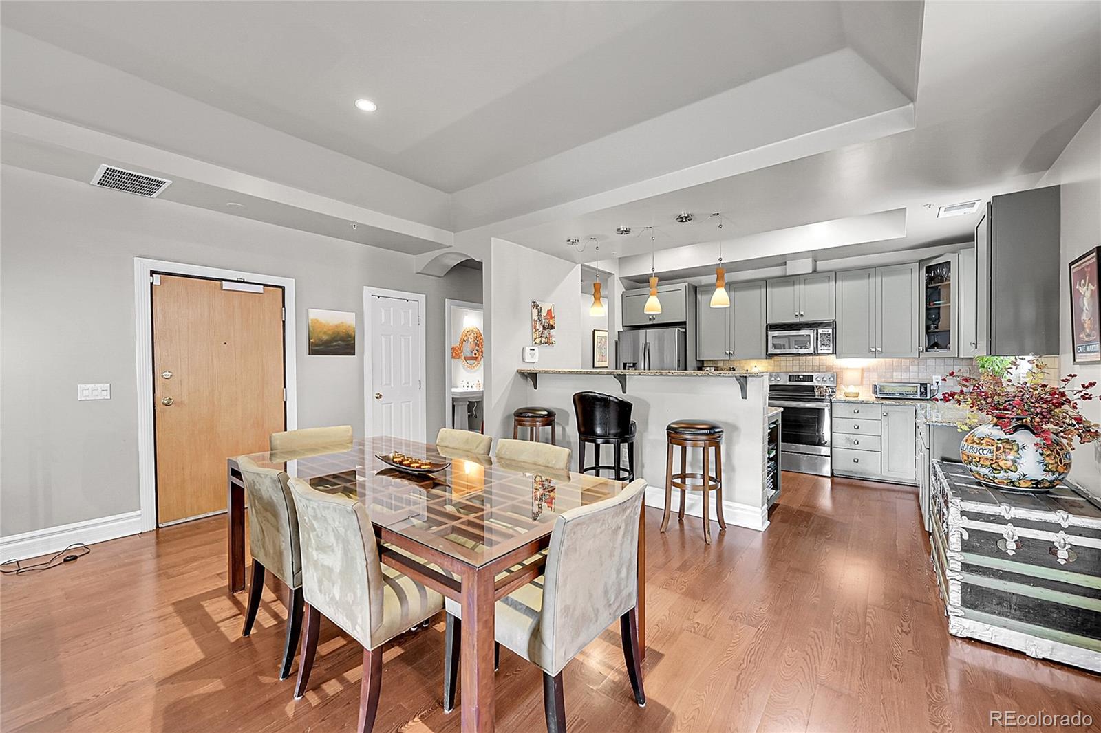 1352 Pennsylvania Street, Unit 2 Denver, CO 80203 - Photo 8 of 45 a living room with lots of furniture and kitchen view