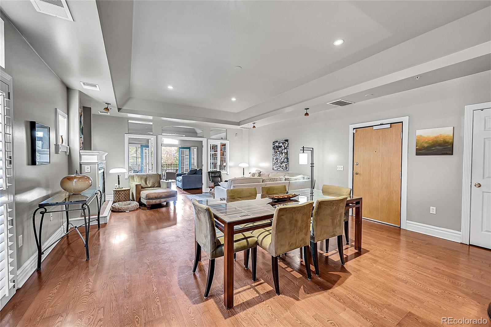 1352 Pennsylvania Street, Unit 2 Denver, CO 80203 - Photo 9 of 45 a view of a dining room with furniture and wooden floor