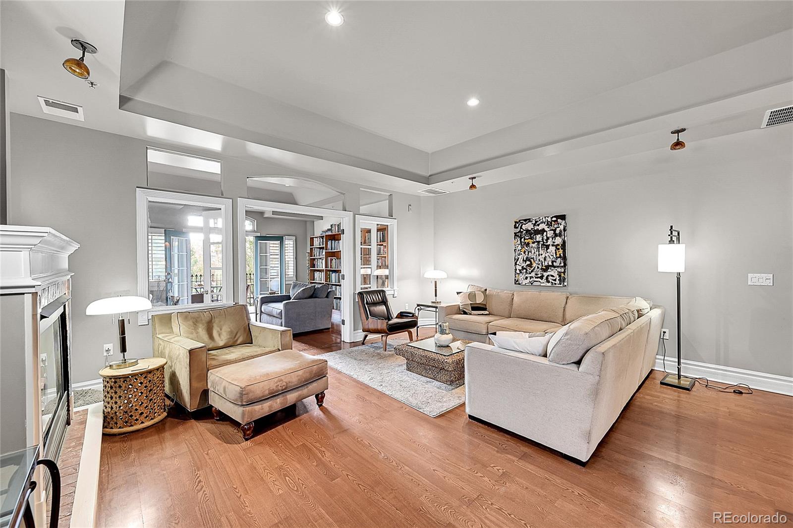 1352 Pennsylvania Street, Unit 2 Denver, CO 80203 - Photo 10 of 45 a living room with furniture and a wooden floor