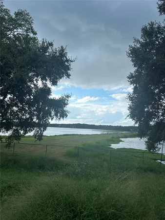 a view of a golf course with a lake
