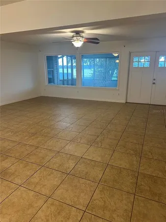 a view of an empty room and window