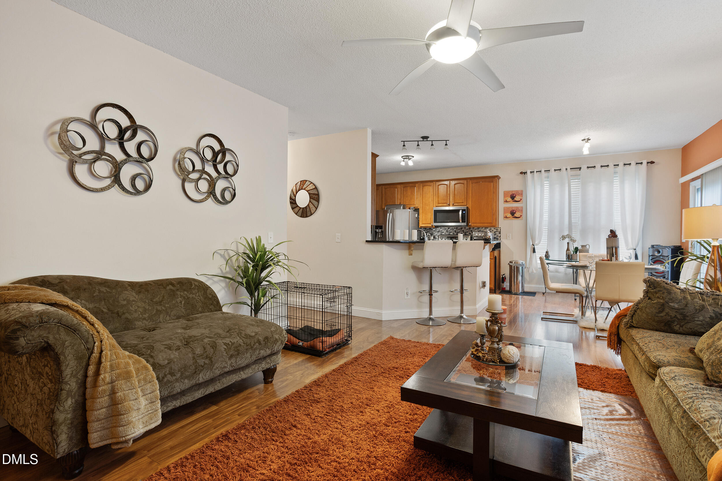 101 Cedar Key Landing Garner, NC 27529 - Photo 13 of 37 a living room with furniture a rug and a chandelier