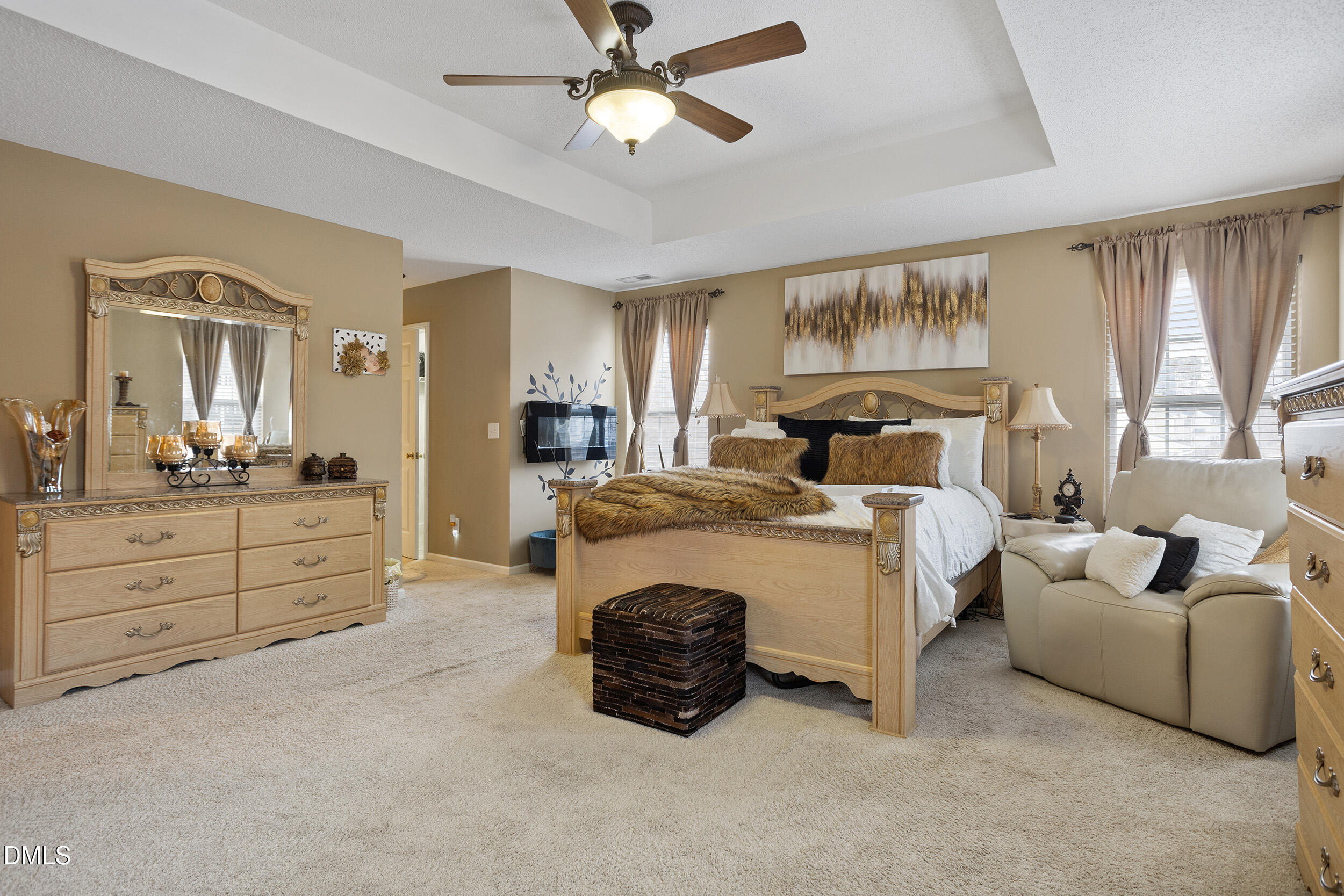 101 Cedar Key Landing Garner, NC 27529 - Photo 19 of 37 a spacious bedroom with a bed and ceiling fan
