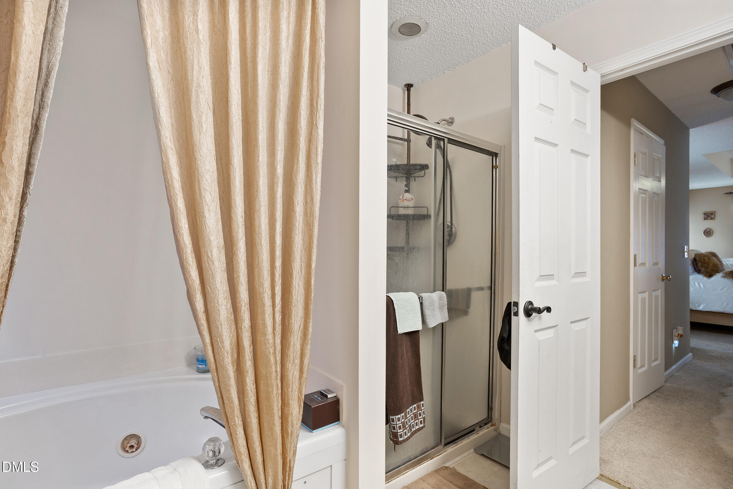 101 Cedar Key Landing Garner, NC 27529 - Photo 21 of 37 a bathroom with a shower and a tub