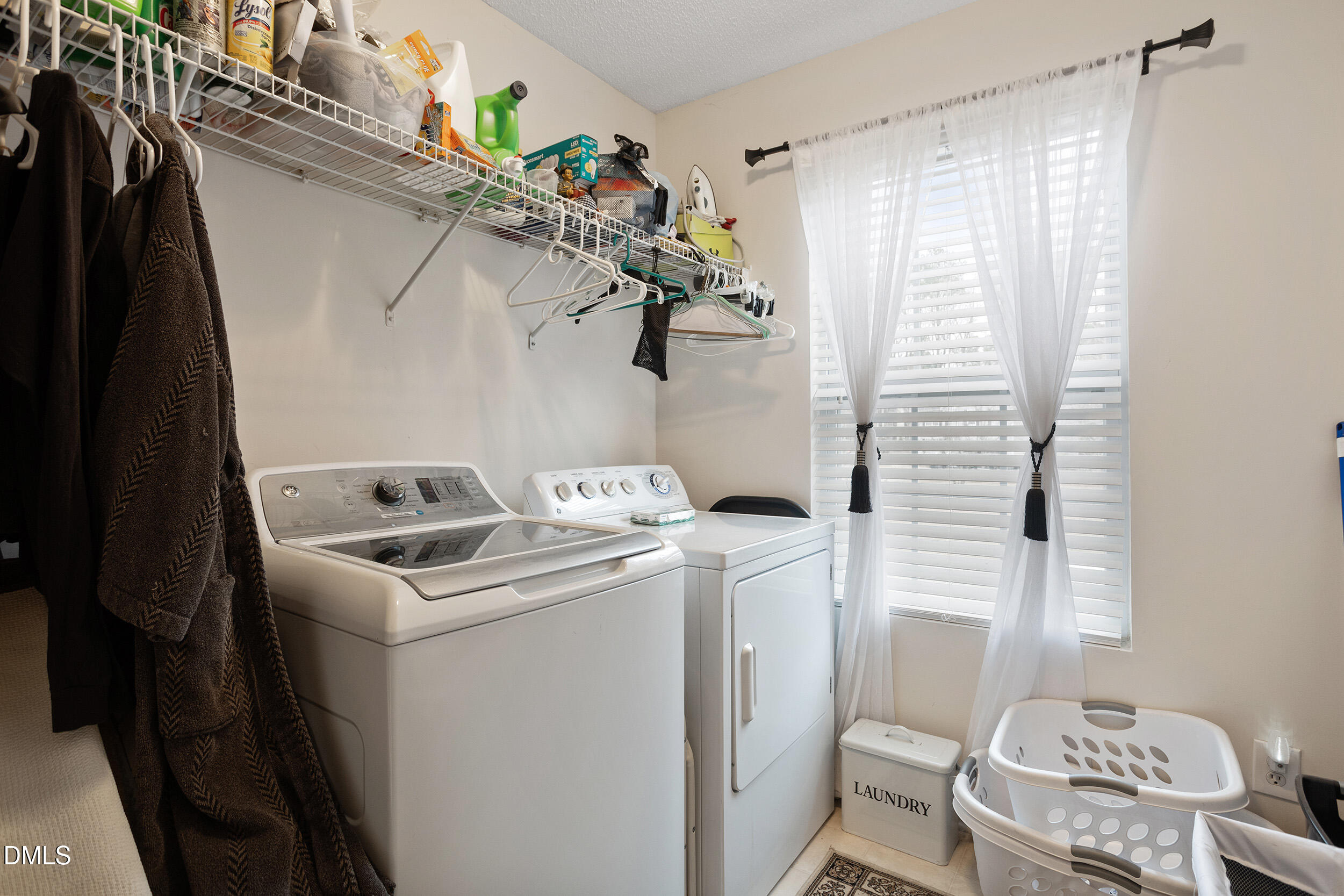 101 Cedar Key Landing Garner, NC 27529 - Photo 28 of 37 a utility room with dryer and washer