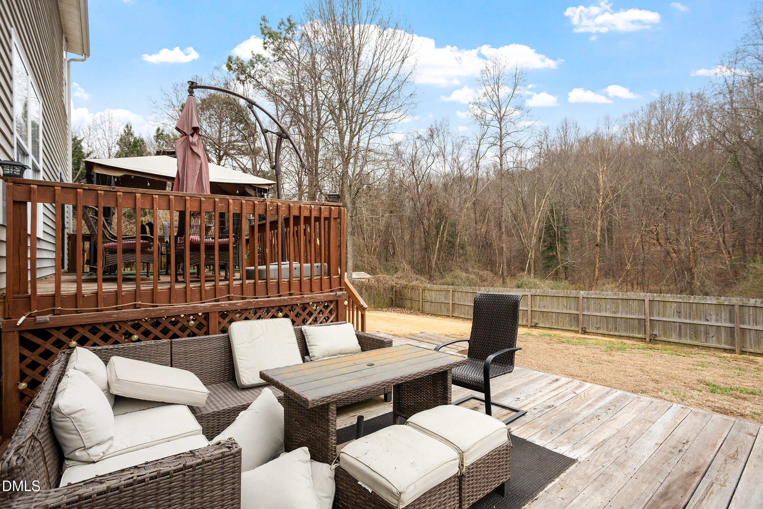 101 Cedar Key Landing Garner, NC 27529 - Photo 29 of 37 a view of a patio with couches table and chairs and wooden floor