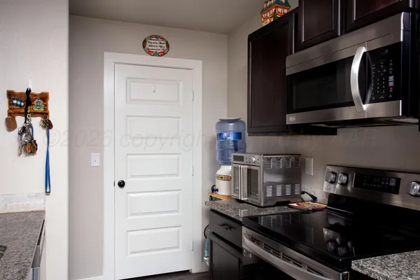 a kitchen with a stove and a microwave