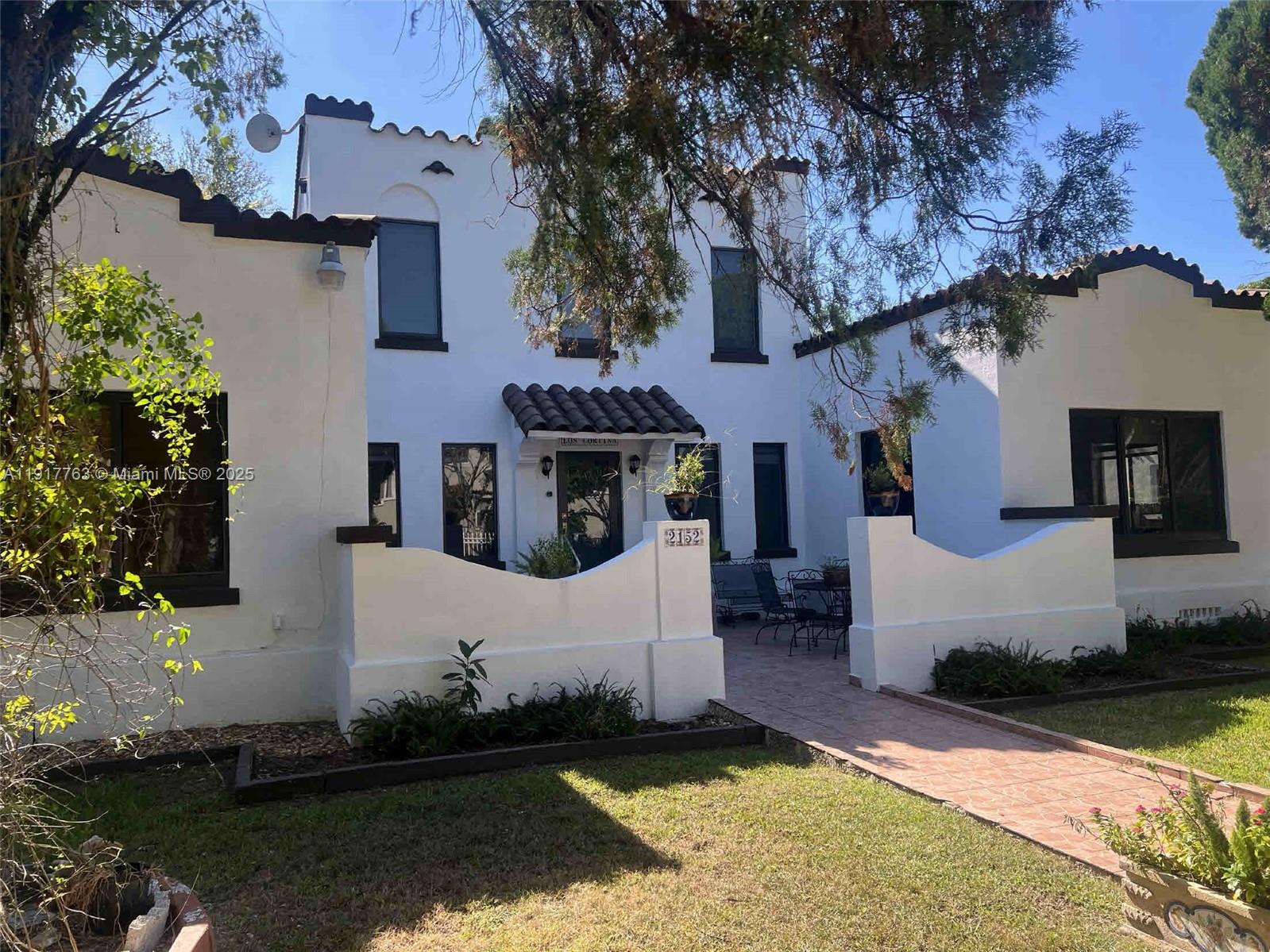 front view of a house with a yard