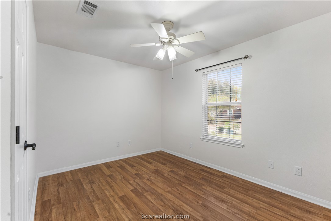 3709 Springfield Drive College Station, TX 77845 - Photo 15 of 23 an empty room with wooden floor fan and windows