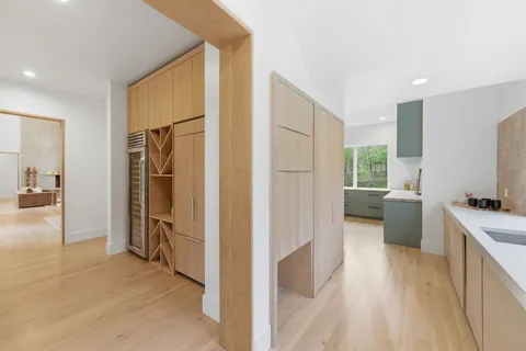 a bedroom with a large bed and a large window