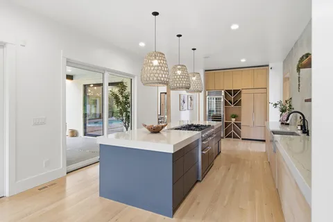 a view of an empty room with a chandelier