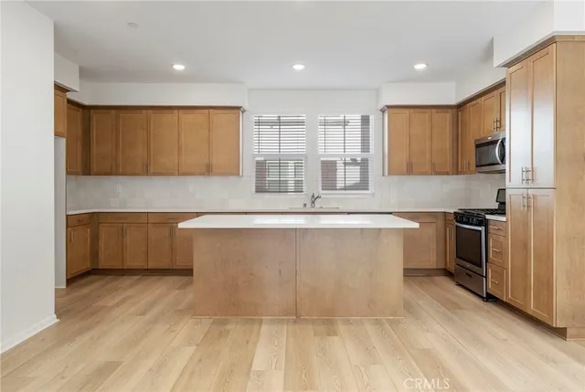 a view of kitchen with wooden floor