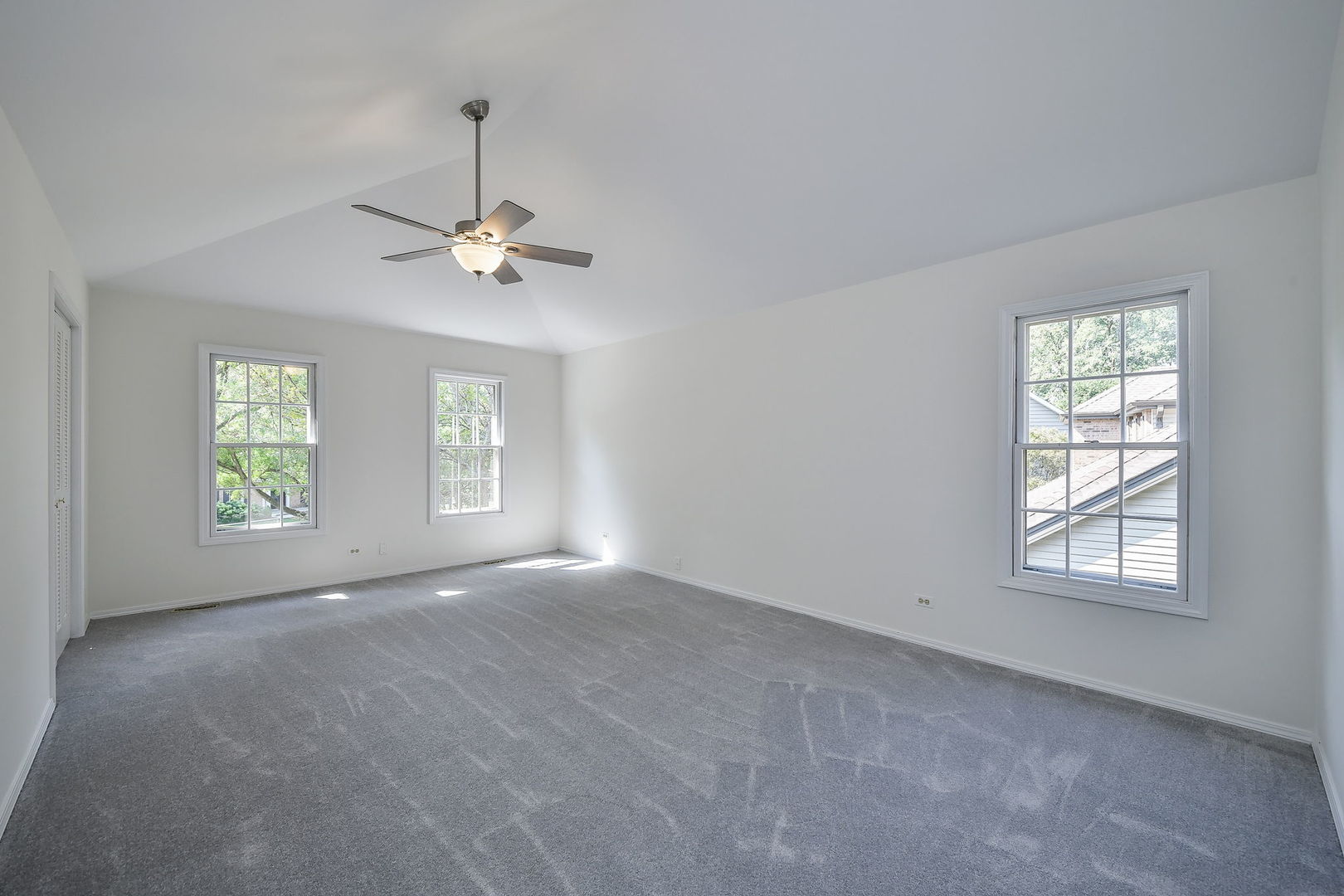 825 Biltmore Court Naperville, IL 60563 - Photo 15 of 43 an empty room with windows and ceiling fan