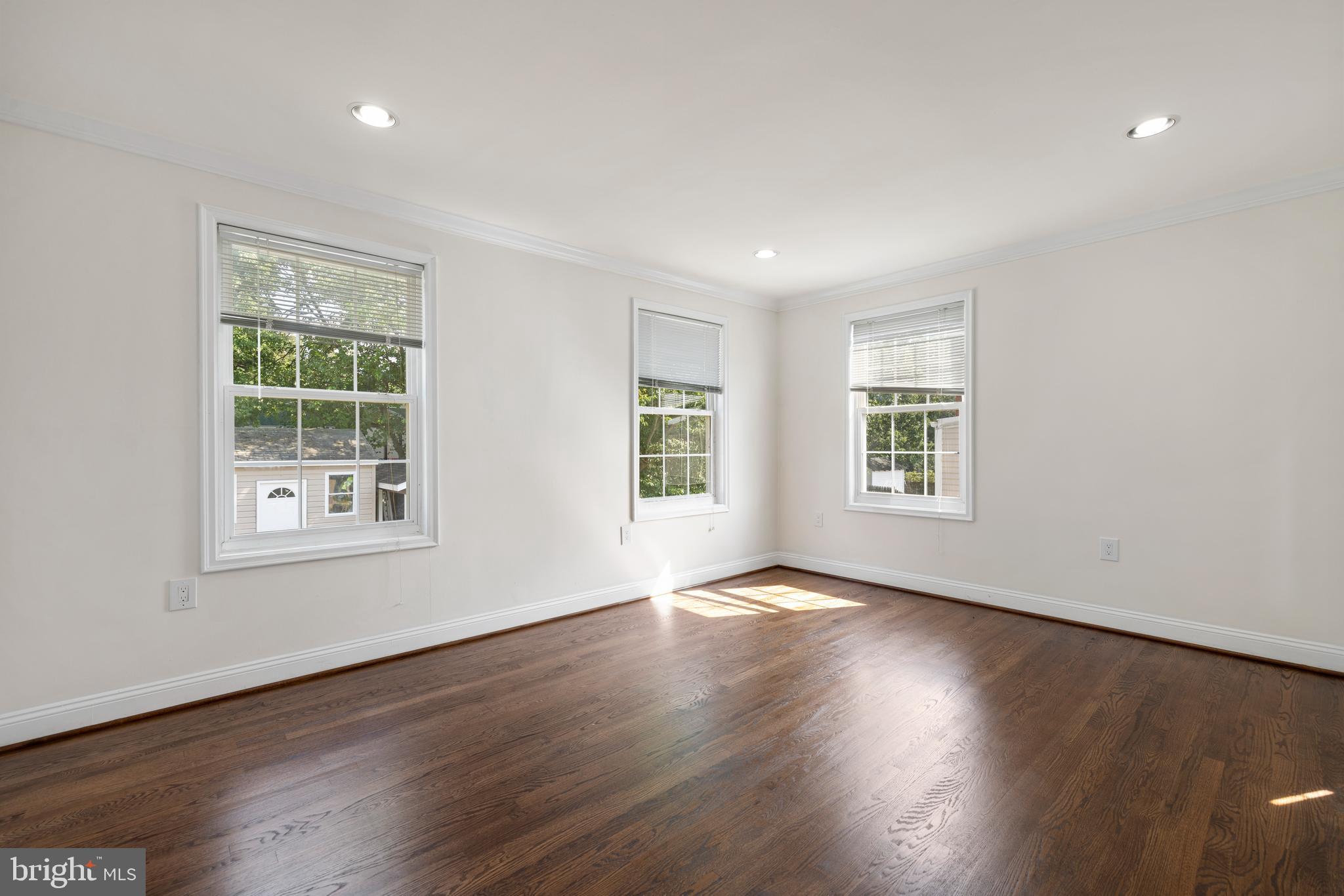 12025 Claridge Road Silver Spring, MD 20902 - Photo 10 of 25 a view of an empty room with wooden floor and a window