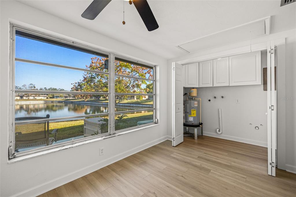 4324 Summersun Drive New Port Richey, FL 34652 - Photo 19 of 43 a view of a kitchen with fridge and wooden floor