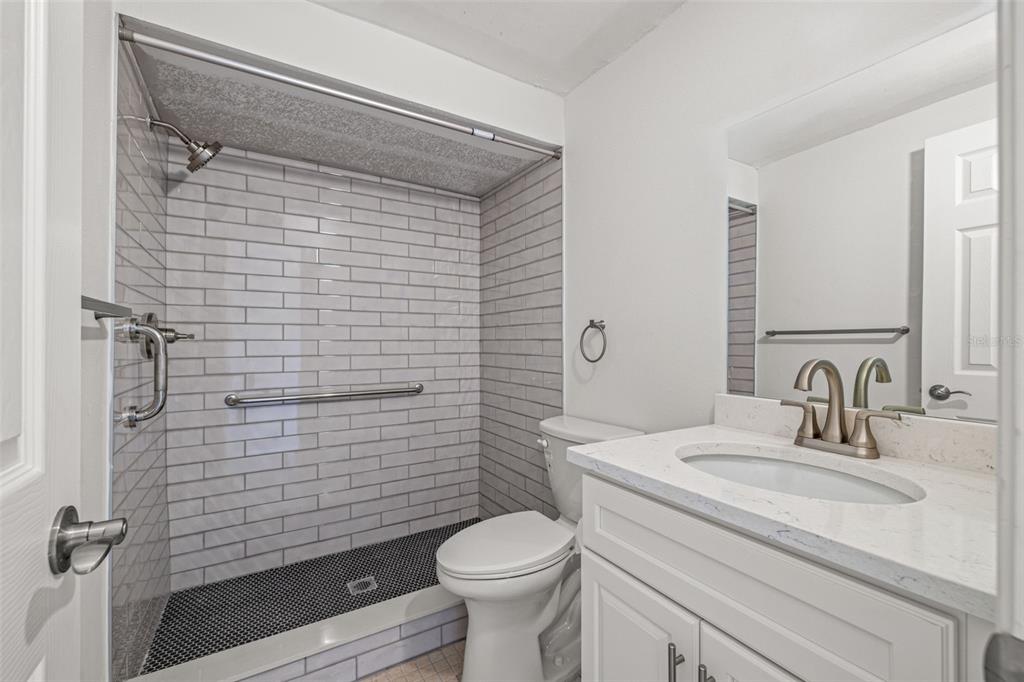 4324 Summersun Drive New Port Richey, FL 34652 - Photo 23 of 43 a bathroom with a sink toilet and shower