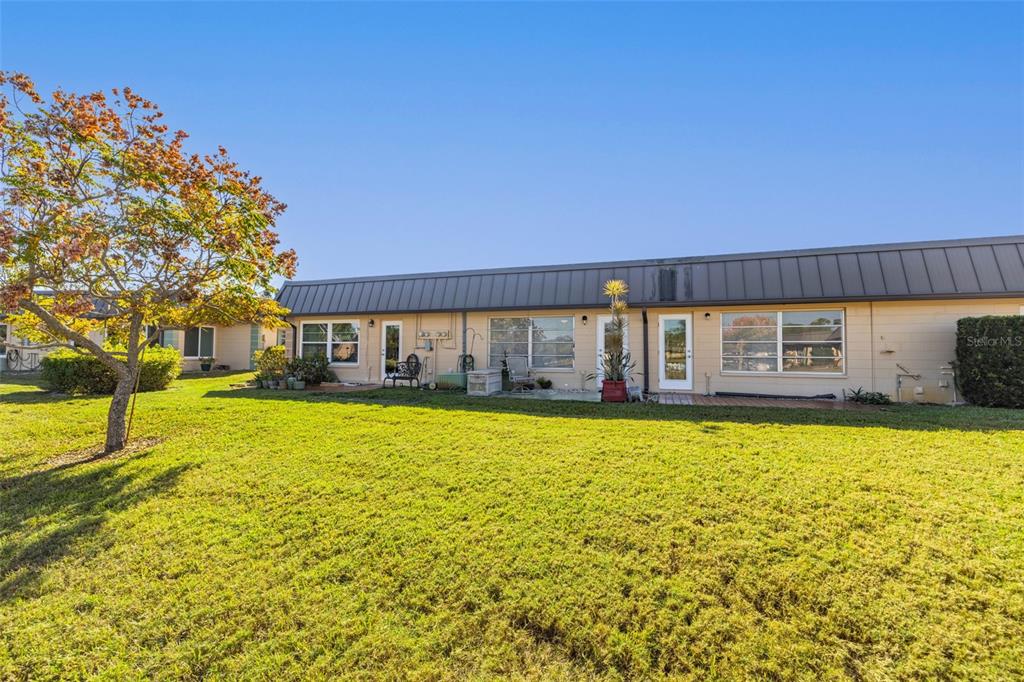 4324 Summersun Drive New Port Richey, FL 34652 - Photo 28 of 43 a front view of a house with a yard