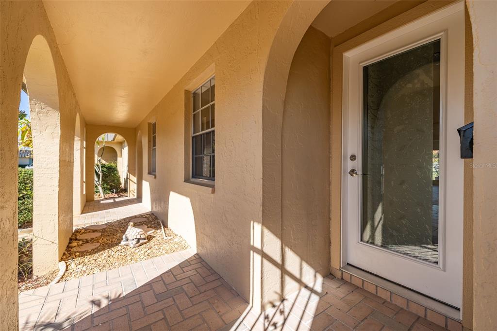 4324 Summersun Drive New Port Richey, FL 34652 - Photo 4 of 43 a view of a hallway with wooden floor and a livingroom