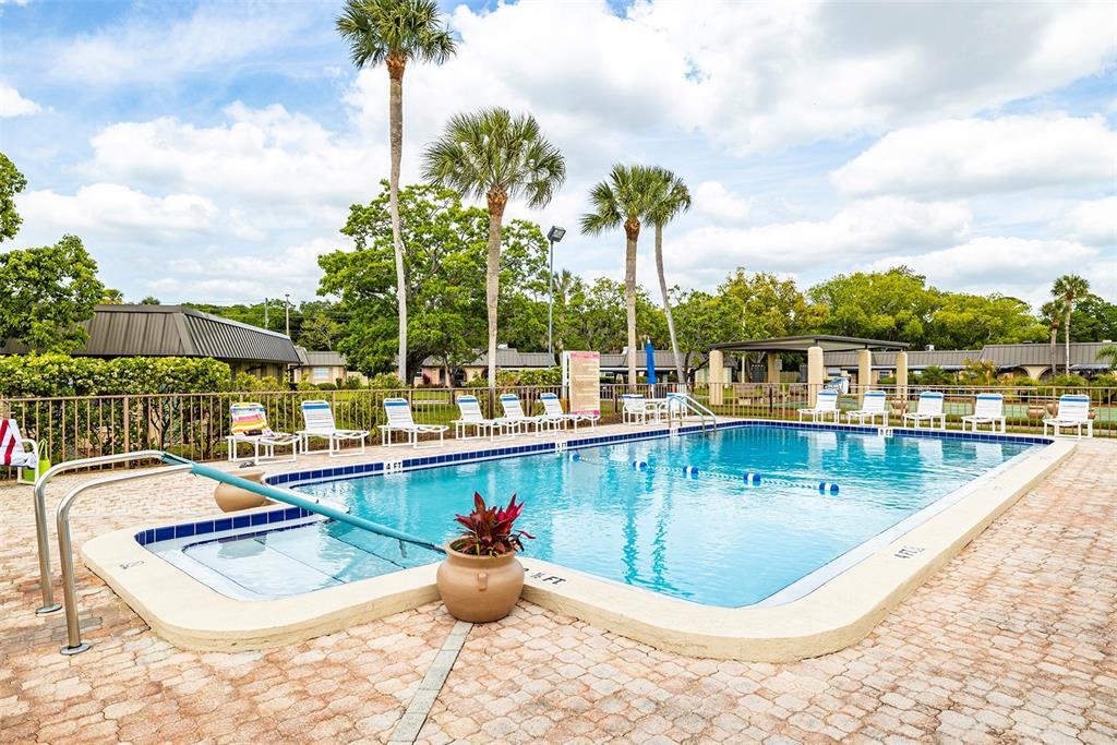 4324 Summersun Drive New Port Richey, FL 34652 - Photo 41 of 43 a view of a swimming pool with a lounge chair