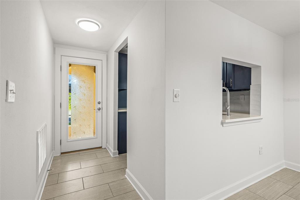 4324 Summersun Drive New Port Richey, FL 34652 - Photo 6 of 43 a view of a hallway with closet and a bathroom