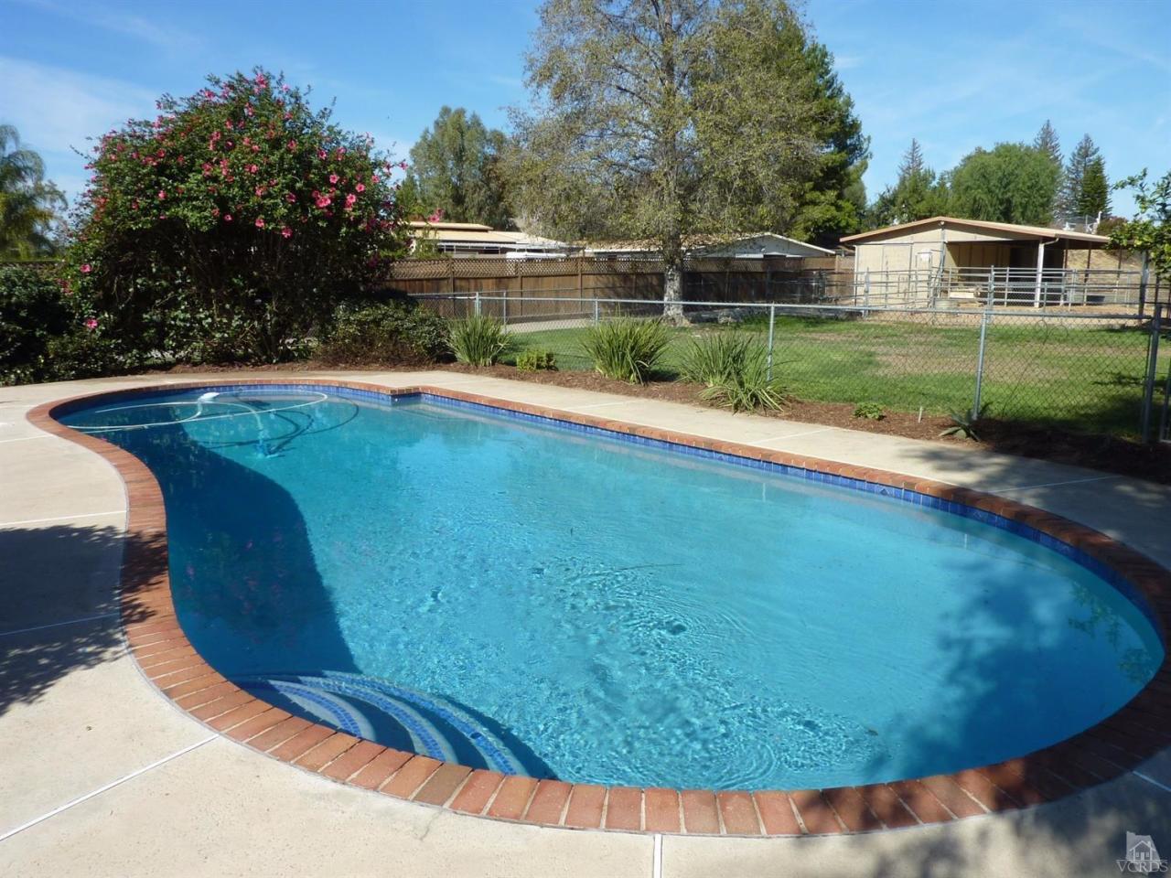 1707 Rambling Road Simi Valley, CA 93065 - Photo 4 of 29 a view of a swimming pool with a yard