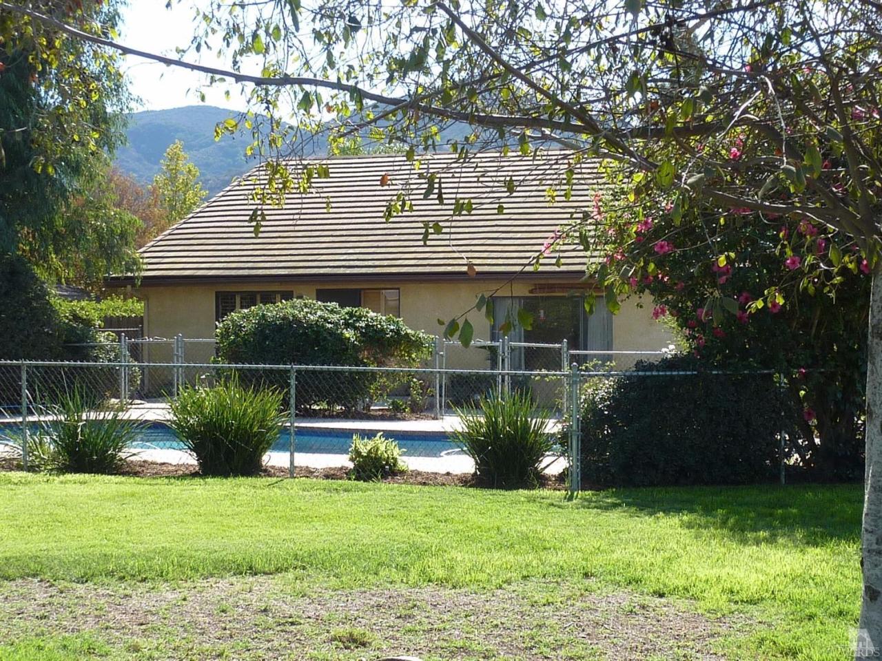 1707 Rambling Road Simi Valley, CA 93065 - Photo 7 of 29 a front view of a house with a yard