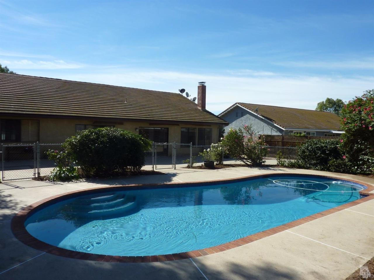 1707 Rambling Road Simi Valley, CA 93065 - Photo 8 of 29 a view of house with swimming pool yard fire pit and outdoor seating